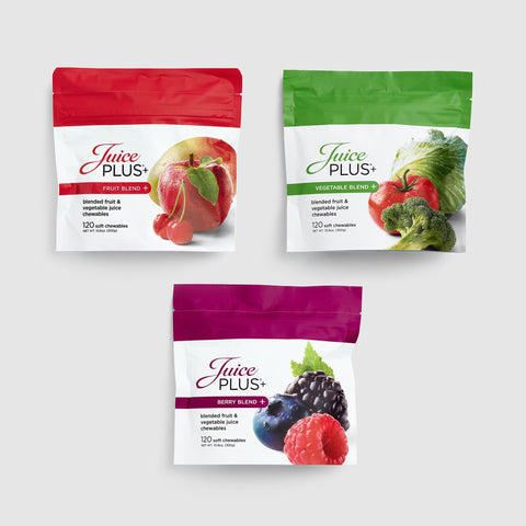 Three packages of Juice Plus+ Chewables on a white background
