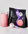 Juice Plus+ Perform Fruit Fusion protein shake mix with a glass of pink shake and scoop on a light background
