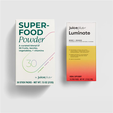 Two boxes of Juice Plus+ products on a light gray background