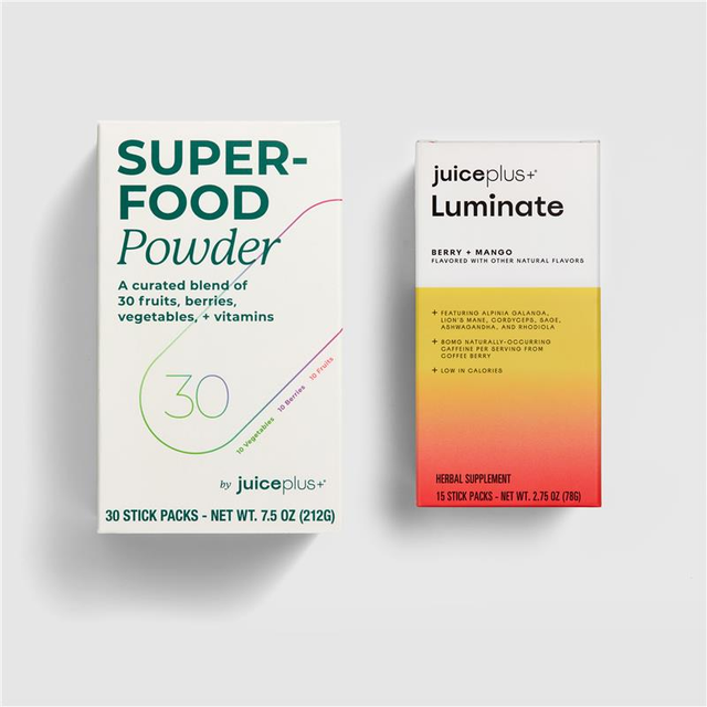 Two boxes of Juice Plus+ products on a light gray background