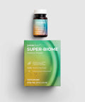 Juiceplus Super-Biome Probiotic Powder shown with its green and yellow product box and a small dark bottle with a white cap on a light gray background.
