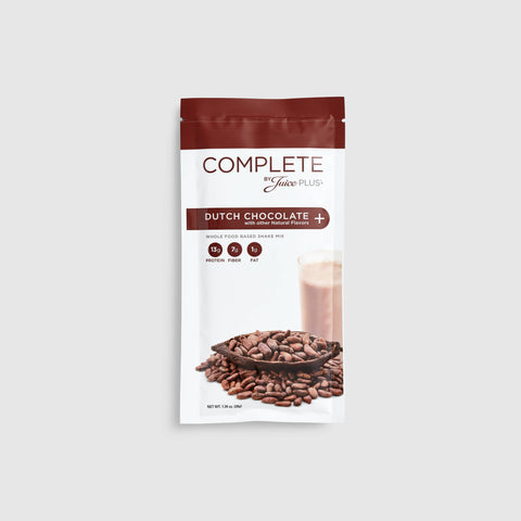 A sachet of Juice Plus+ Complete Dutch Chocolate flavor, showing the product name, an image of chocolate chips, and a prepared chocolate drink.